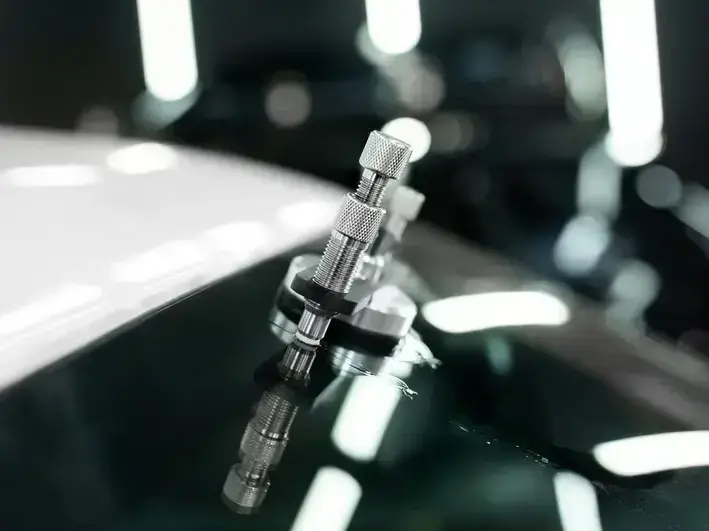 Technician repairing windshield chip on a car in Seattle’s South Lake Union neighborhood