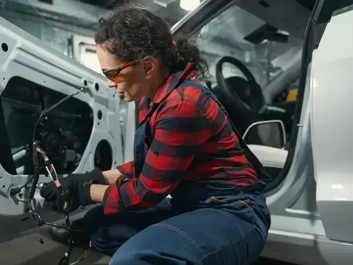 auto glass technician replacing cracked windshield near Factoria Mall in Bellevue WA